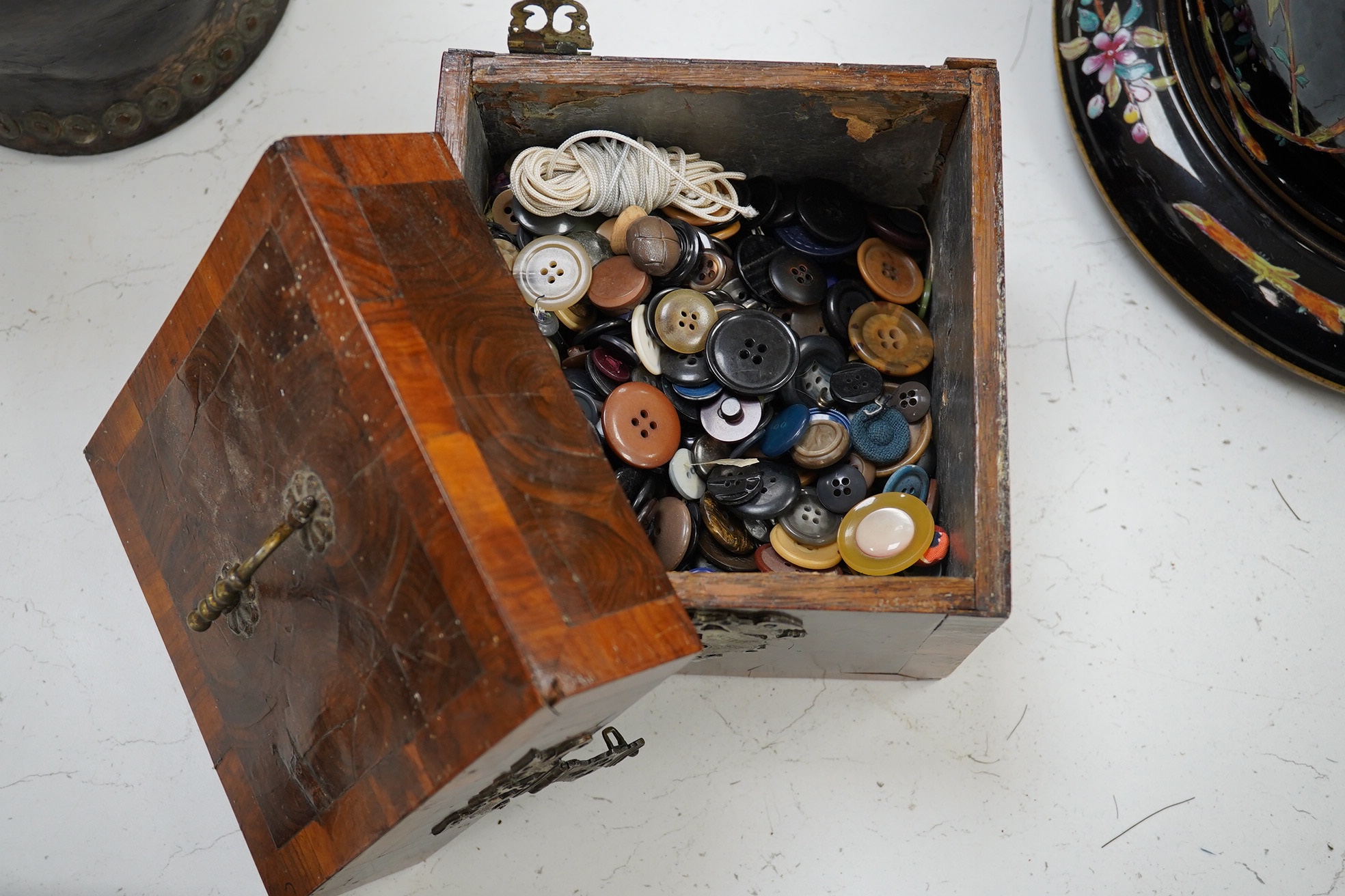 An 18th century German kingwood and olive wood veneered casket, containing a large quantity of buttons, 17 x 16.5 x 16.5cm. Condition - poor